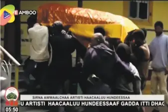  ?? OBN Video ?? The coffin of singer Hachalu Hundessa is carried during his funeral in Ambo, Ethiopia. He had been a prominent voice in antigovern­ment protests that led to a change in leadership in 2018.