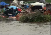  ?? SHMUEL THALER — SANTA CRUZ SENTINEL ?? San Lorenzo Park Benchlands homeless encampment in Santa Cruz flooded in December.