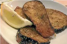  ?? JANAN JAY ?? A lightly crumbed, herbaceous side of aubergine.