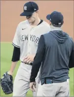  ?? Alex Brandon / Associated Press ?? Yankees pitcher James Paxton, left, had a rough start Saturday, giving up five hits and three runs in one inning.