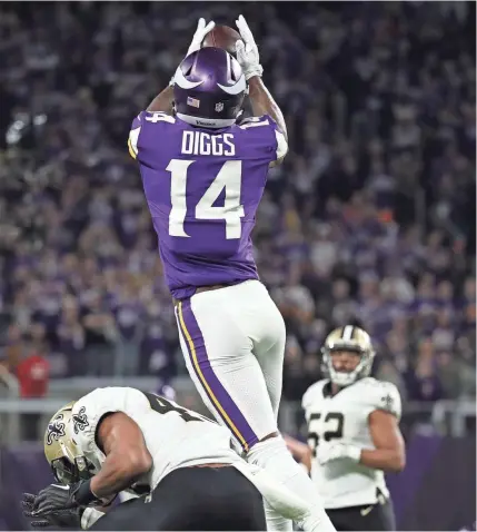  ?? BRACE HEMMELGARN/USA TODAY SPORTS ?? Vikings wide receiver Stefon Diggs catches the game-winning touchdown pass against Saints free safety Marcus Williams (43) during the fourth quarter Sunday at U.S. Bank Stadium.