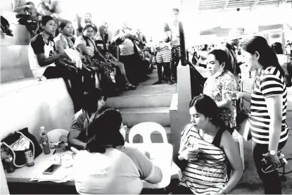  ??  ?? CHECKUP. Pregnant women avail of the free checkup, one of the services offered during the medical mission held on September 28, 2018.