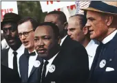  ?? Left, HERALD file photo; above, courtesy photo ?? At left, Big Spring’s annual Martin Luther King Jr. Day walk makes its way down MLK Boulevard in 2020. Above, King speaks during a 1963 Washington, D.C., rally.