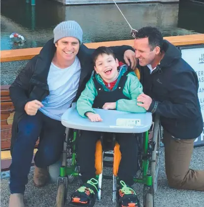  ??  ?? MOUNTAIN MEN: Shane Crawford, left, with Jack Duffy and Jack's Dad, Chris. Crawford is an ambassador for charity Just Like Jack and will be helping Jack and Chris get to the summit in the Point to Pinnacle race.