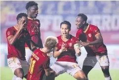  ?? ?? Tero’s Teeratep Winothai, second right, celebrates scoring against Nakhon Ratchasima in the last game of his career.