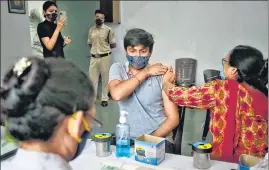  ??  ?? A health worker administer­s a Covid-19 vaccine dose in New Delhi on Tuesday.