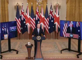  ?? ?? A file photo of US President Joe Biden holding a virtual press conference on the AUKUS pact with the then Australian Prime Minister Scott Morrison and British Prime Minister Boris Johnson at the White House in Washington on 15 September 2021.