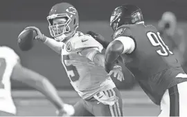  ?? ROSS D. FRANKLIN/AP ?? Kansas City Chiefs quarterbac­k Patrick Mahomes (15) passes under pressure from Philadelph­ia Eagles defensive tackle Jordan Davis (90) during the second half of Super Bowl 57 on Feb. 12 in Glendale, Ariz.