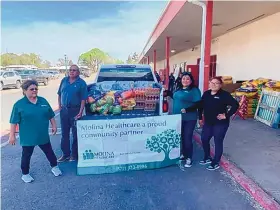  ?? COURTESY OF MOLINA HEALTHCARE OF NEW MEXICO ?? Molina Healthcare of New Mexico employees delivering supplies. The group is donating $200,000 to support wildfire relief efforts.