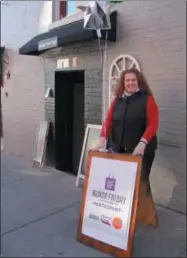  ?? LAUREN HALLIGAN — THE SARATOGIAN ?? Amour New York shop owner Christine Marks participat­es in Black Friday Saratoga for the first time at her shop, which opened in April on Phila Street.