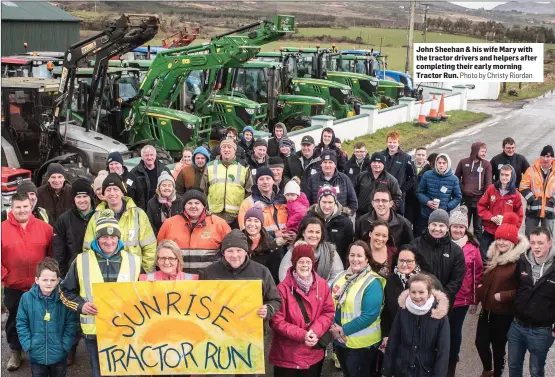  ?? Photo by Christy Riordan ?? John Sheehan & his wife Mary with the tractor drivers and helpers after completing their early morning Tractor Run.