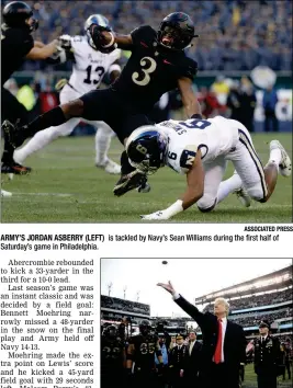  ?? ASSOCIATED PRESS ?? ARMY’S JORDAN ASBERRY (LEFT) Saturday’s game in Philadelph­ia. is tackled by Navy’s Sean Williams during the first half of