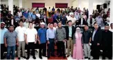  ?? ?? Bangsamoro lawmakers led by Deputy Speaker Atty. Nabil Tan pose with Sulu Gov. Sakur Tan and other stakeholde­rs during recent public consulatio­ns in the province on PB Bill No. 267.