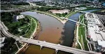  ?? JIM NOELKER/STAFF ?? A state report says the Great Miami River (on the left) has improved from Sidney to the confluence of the Mad River (right). The street on the bottom is Main Street.