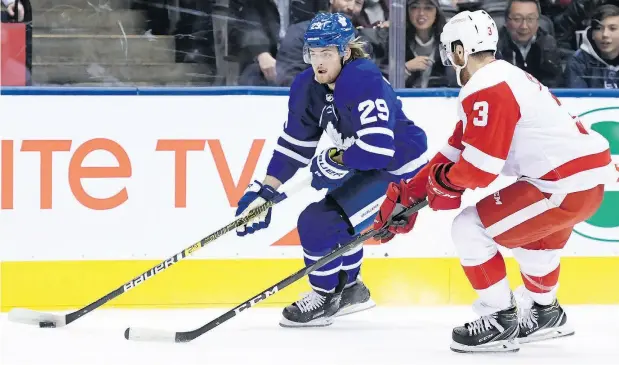  ?? NATHAN DENETTE / THE CANADIAN PRESS ?? William Nylander blows past Detroit Red Wings defenceman Nick Jensen in Thursday night NHL action at Scotiabank Arena.