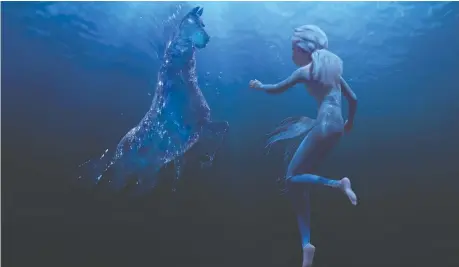  ?? DISNEY ?? Elsa, right, encounters a water spirit that takes the form of a horse in Frozen II. The Nokk is one of several enchanted creatures in the sequel.