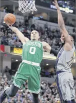  ?? Michael Conroy / Associated Press ?? Boston’s Jayson tatum goes up for a dunk over indiana’s thaddeus Young on friday. tatum finished with 22 points.