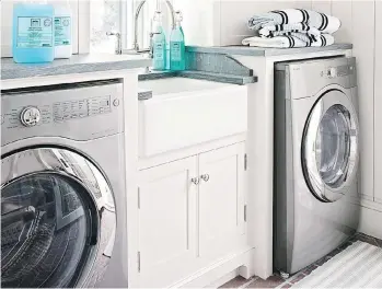  ?? TIME INC. BOOKS ?? Declutteri­ng and cleaning your laundry area is a good way to begin the fall. This tidy laundry room appears in The Real Simple Method to Organizing Every Room, by the editors of Real Simple magazine.