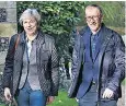  ??  ?? Theresa May and husband Philip attend church yesterday in Reading, Berkshire