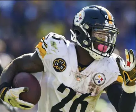  ?? GAIL BURTON - THE ASSOCIATED PRESS ?? FILE - In this Oct. 1, 2017, file photo, Pittsburgh Steelers running back Le’Veon Bell (26) carries the ball during the second half of an NFL football game against the Baltimore Ravens in Baltimore.