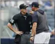  ?? KATHY WILLENS — THE ASSOCIATED PRESS ?? Yankees’ manager Aaron Boone yells at home plate umpire Brennan Miller during the second inning of the first game of Thursday’s doublehead­er at Yankee Stadium in New York.