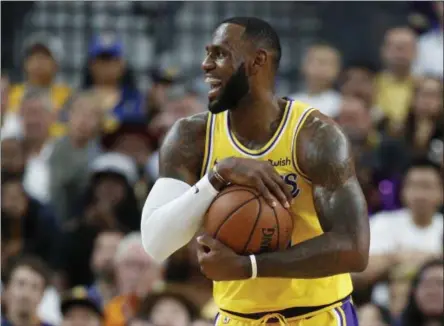  ?? RYAN LOCHER — THE ASSOCIATED PRESS ?? Los Angeles Lakers forward LeBron James reacts after a play against the Golden State Warriors during the first half of an NBA preseason basketball game Wednesday, Oct. 10, 2018, in Las Vegas.