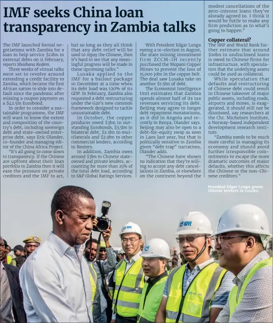  ??  ?? President Edgar Lungu greets Chinese workers in Lusaka.