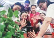  ?? XU CHANG / XINHUA ?? Startup team members hold a video conference with their Shanghai colleagues in Taonan, Jilin province. They are female university graduates from northeaste­rn China and who decided to start businesses in their hometown.