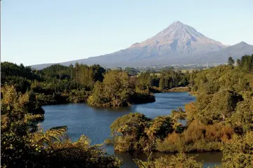  ??  ?? Above: Mt Egmont for Lake Mangamahoe. Middle left: Warning sign by the dam area. Below right: Informatio­n map of the area.