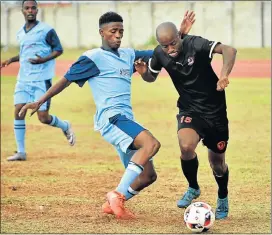  ?? Picture: EUGENE COETZEE ?? WINNING WAYS: Bush Bucks’ Andile Peter, left, and Lion City’s Somila Mlumbi fight for the ball during a Motherwell Easter Soccer tournament match at the NU2 Stadium on Monday