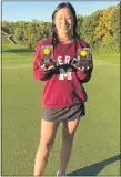  ?? COURTESY PHOTO ?? Farmington Hills Mercy sophomore Chloe Vig holds up the two balls she used to hit a pair of holes-inone at the Detroit Golf Club. The two aces came just four days a part, both during CSHLmatche­s.