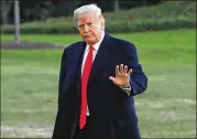  ?? GETTY ?? President Donald Trump, linked to a federal crime for the first time, arrives back at the White House on Friday after a speaking engagement in Kansas City, Missouri.