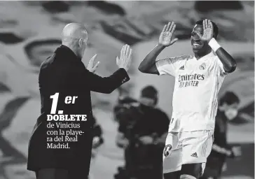  ?? FOTO: AFP ?? > Vinicius celebra su tanto con Zidane.