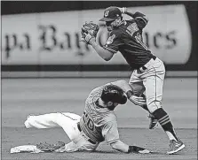  ?? [STEVE NESIUS/THE ASSOCIATED PRESS] ?? The Tampa Bay Rays’ Steven Souza Jr. breaks up a double play with his slide into Indians shortstop Francisco Lindor after being forced out at second base in the second inning Sunday.