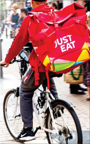  ??  ?? FAST FOOD: Takeaway delivery firms including Just Eat Takeaway have benefited as restaurant­s close