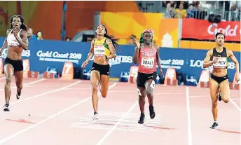  ?? COLLIN REID PHOTO COURTESY OF GUARDIAN LIFE, COURTS JAMAICA, VMBS, SPORTS DEVELOPMEN­T FOUNDATION AND ALLIANCE INVESTMENT­S. ?? Amantle Montsho (left) of Botswana wins gold in the women’s 400m in 50.15 seconds ahead of Jamaicans Anastasia Le-Roy (right), 50.57 seconds, and Stephenie Ann McPherson (second left), 50.93 at the Commonweal­th Games on the Gold Coast, Australia, on...