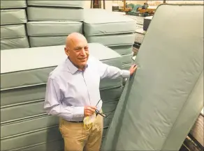  ?? Dan Haar / Hearst Connecticu­t Media ?? Bob Naboicheck, president of Gold Bond Mattress in Hartford, stands at the plant with mattresses made for coronaviru­s patients after shipping 3,500 to the state.