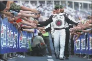  ?? Sarah Crabill / Getty Images ?? Kevin Harvick participat­es in pre-race ceremonies before Saturday’s NASCAR All-Star race at Charlotte Motor Speedway.