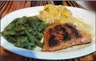  ?? Special to the Democrat-Gazette/ANN BLAYLOCK ?? Grilled salmon comes with green beans and baked squash at Woodland Bakery & Bistro.