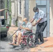  ?? AP ?? Mehul Choksi is taken to a police van by an officer after attending a court hearing in Roseau, Dominica.