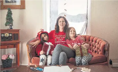  ?? HABITAT FOR HUMANITY GTA PHOTOS ?? “I never knew I’d come out of this with more than a house,” said Fiona Church, with daughters Andrea and Alice.