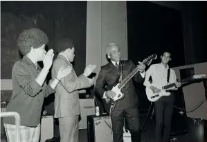  ??  ?? LEFT: Booker T. & the MGs perform at Hunter College, New York City, January 21, 1967. ABOVE: Rehearsing at Stax with Pop Staples and the Staples Singers, December 20, 1968. BELOW: At Hunter College