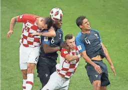  ??  ?? From left: Croatia's Dejan Lovren, France's Paul Pogba, Croatia's Ivan Perisic and France's Raphael Varane challenge for the ball in Moscow on Sunday.