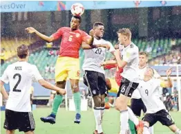  ?? PTI ?? Players of Guinea and Germany (white) vie for the ball during their match in Kochi on Friday