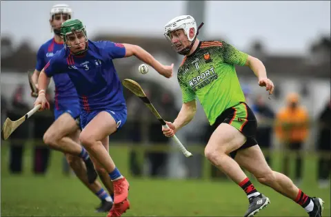  ??  ?? Cathal Dunbar of I.T. Carlow taking on Mary Immaculate defender David Prendergas­t during Saturday’s semi-final.