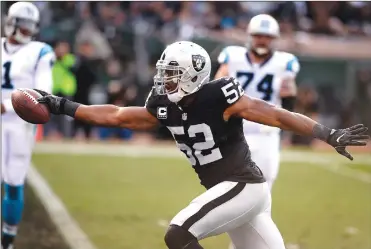  ??  ?? Oakland Raiders defensive end Khalil Mack crosses the goal line for a touchdown after intercepti­ng a pass by Carolina Panthers quarterbac­k Cam Newton during a game on Nov. 27, 2016 at the Oaklandala­meda County Coliseum in Oakland.