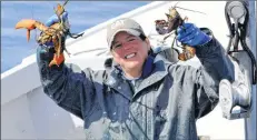  ?? KATHY JOHNSON ?? Chrissie Smith holds up part of the catch from a trap from a fishing trip with her father Donnie alongside the Cape Sable Island Causeway earlier this month. The lobster season closes in LFAs 33 and 34 on May 31.