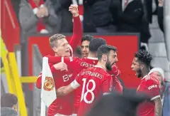  ?? AFP ?? Manchester United’s Scott McTominay, left, celebrates with teammates.