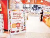  ?? PETER PARKS/AFP ?? A sign, seen in a Coles supermarke­t, advises its customers of its plastic bag policy in Sydney on July 2.