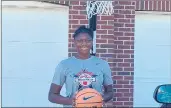  ?? PHOTO PROVIDED BY JASMINE BROWN ?? Joliet Catholic sophomore Jasmine Brown wears her Blue Star All-America Camp T-shirt outside of her home on Monday.